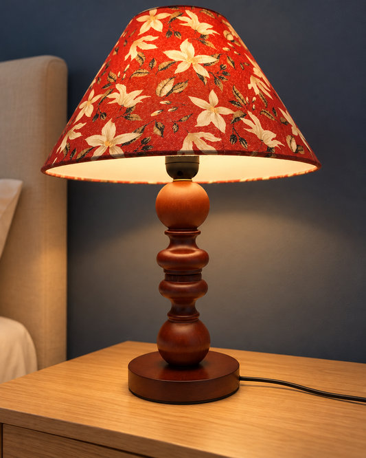 Petal floral-shade wooden lamp illuminated beside a bed