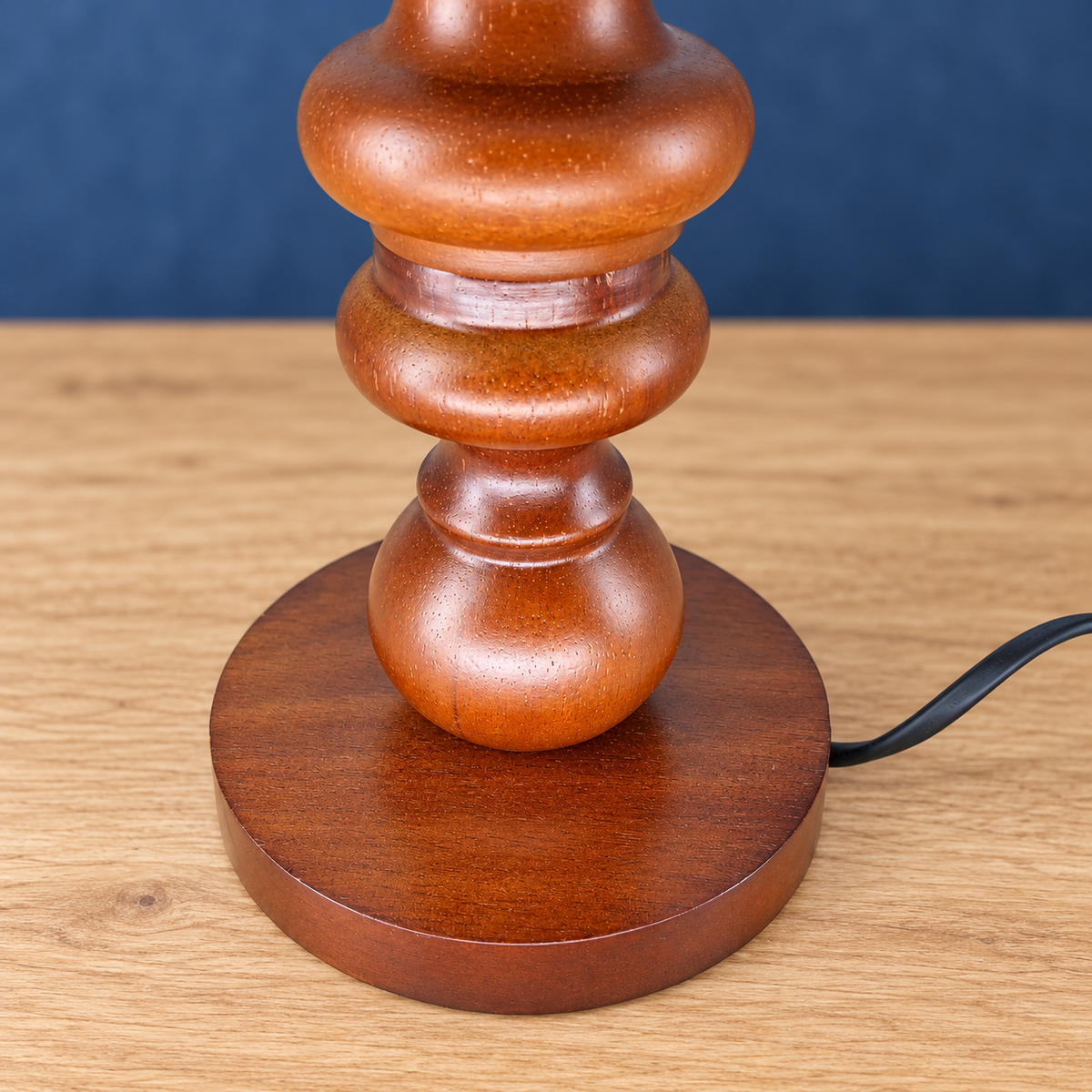Close-up of the Petal lamp turned wooden stem and round base