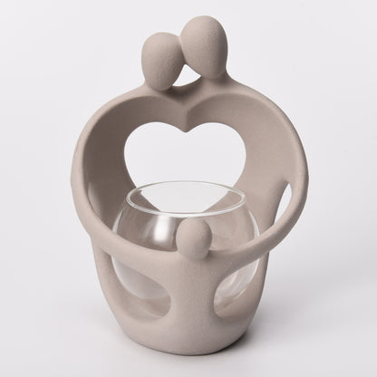 Family Embrace Tealight Holder in frappe taupe, front view
