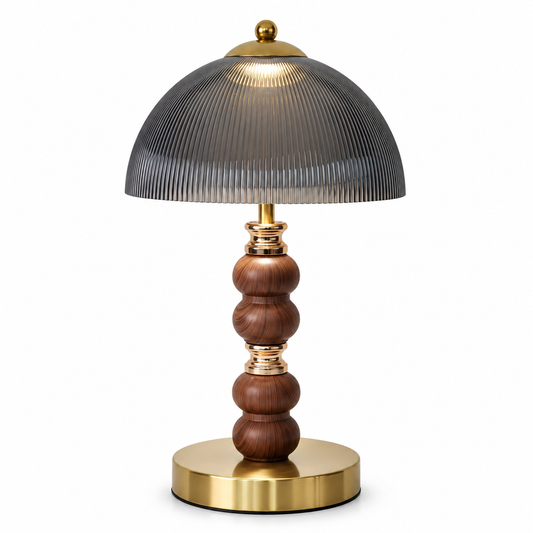 Smoked ribbed acrylic dome table lamp with gold-tone accents and a dark stem