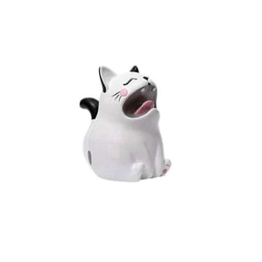 The Sleepyhead: seated white-and-black cat figurine with closed eyes and a wide pink-mouthed yawn.
