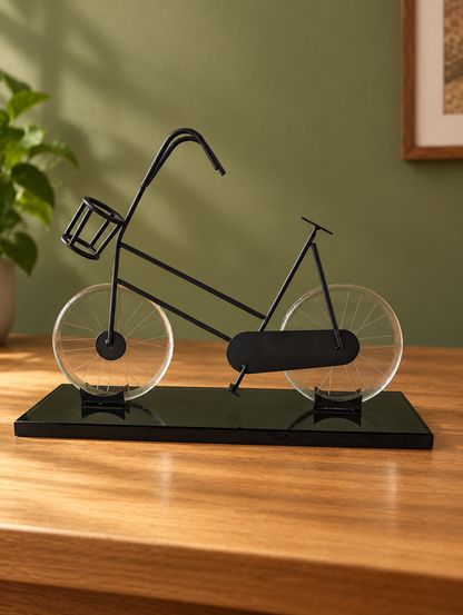 Carbon Black Promenade bicycle sculpture with clear crystal-glass wheels and a black glass base