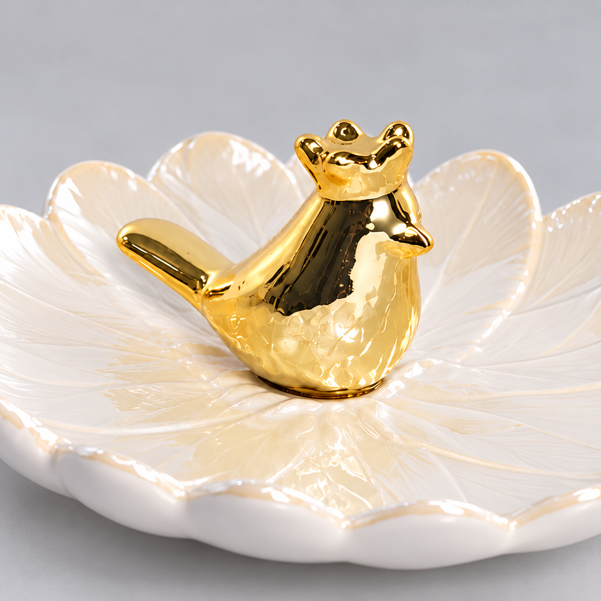 Golden Bird Trinket Dish — close-up of gold bird and glossy porcelain
