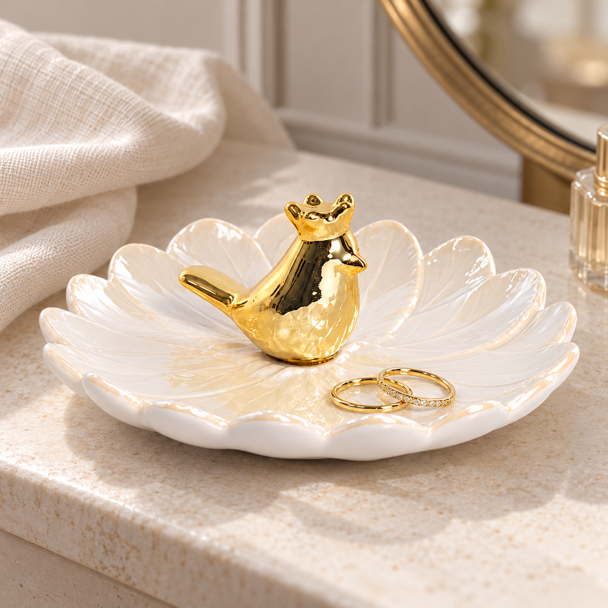 Golden Bird Trinket Dish — styled on a stone dressing table