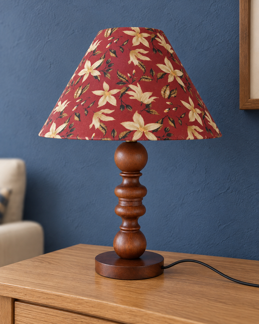 Petal wooden table lamp with floral fabric shade, shown unlit on a light oak console