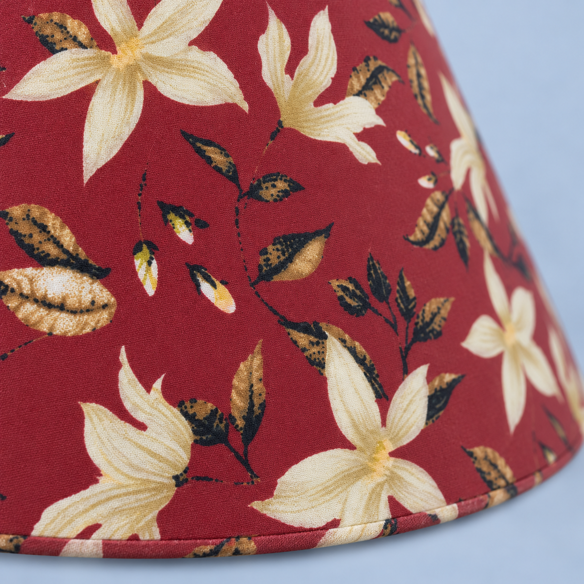 Close-up of the cream floral print on the Petal lamp fabric shade