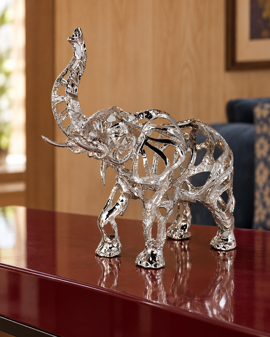 Regal openwork alloy elephant in Silver Chrome, styled on a console