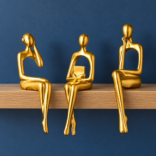 Muse Thinker Trio in Gold — three seated figures with head-resting, book-holding and chin-resting poses