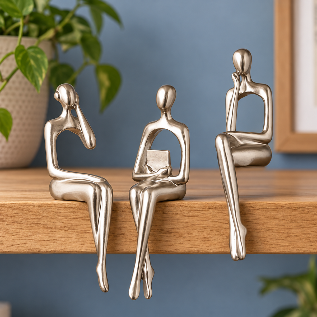 Muse Thinker Trio in Silver — three-piece set styled on an oak shelf
