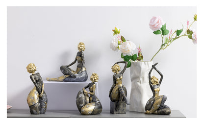 Gilt Sprig Lady, Arm Raised on a console