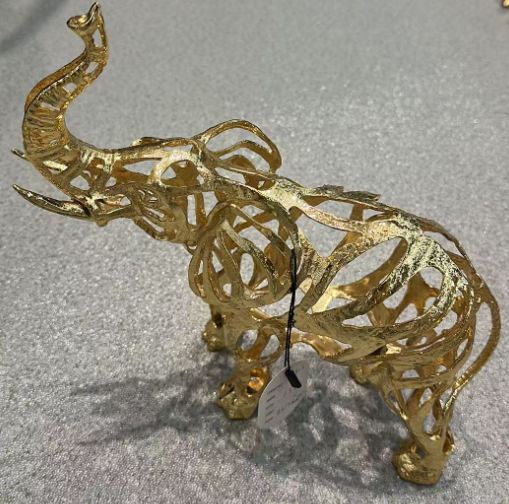 Regal openwork alloy elephant in warm gold tone, model 21902